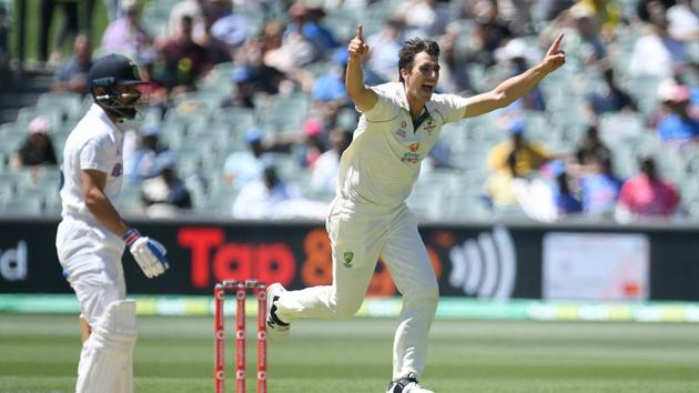Australian bowler Pat Cummins reacts after dismissing Indian captain Virat Kohli (L) for 4 runs on day 3 of the first test match between Australia and India at Adelaide Oval, Adelaide, Australia, December 19, 2020. AAP Image/Dave Hunt via REUTERS ATTENTION EDITORS - THIS IMAGE WAS PROVIDED BY A THIRD PARTY. NO RESALES. NO ARCHIVE. AUSTRALIA OUT. NEW ZEALAND OUT(via REUTERS)