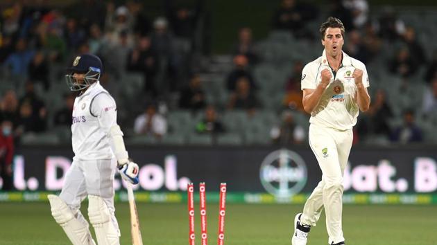 Australian bowler Pat Cummins reacts after dismissing Indian batsman Prithvi Shaw (L) for 4 runs on day 2 of the first test match between Australia and India at Adelaide Oval, Adelaide, Australia, December 18, 2020.(via REUTERS)