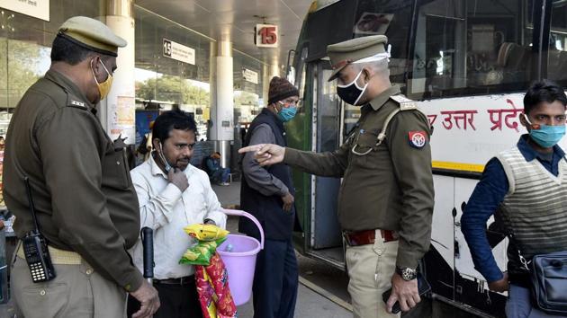 Police personnel ensuring face masks are worn correctly by people at Qaiserbagh bus station in Lucknow on December 17. In contrast, almost all of India’s indicators are exhibiting positive signs – the rate of new cases and deaths are the lowest in at least five months and have dropped over 70% from peak of the first wave, and the positivity rate is the lowest ever recorded, HT reported. (Dheeraj Dhawan / HT Photo) 