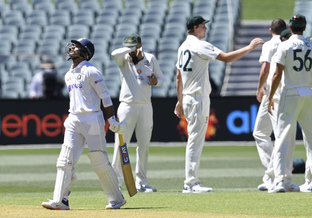 India's Mayank Agarwal, left, walks off after he is dismissed by Australia's Josh Hazlewood on the third day of their cricket test match at the Adelaide Oval in Adelaide, Australia, Saturday, Dec. 19, 2020. (AP Photo/David Mairuz) (AP)