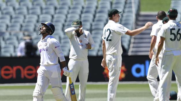 India's Mayank Agarwal, left, walks off after he is dismissed by Australia's Josh Hazlewood on the third day of their cricket test match at the Adelaide Oval in Adelaide, Australia, Saturday, Dec. 19, 2020. (AP Photo/David Mairuz)(AP)