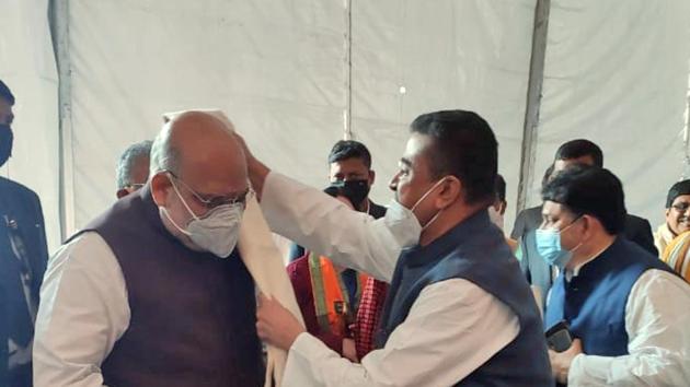 Suvendu Adhikari felicitates Home Minister Amit Shah during a public rally, at Midnapore College Ground, in Midnapore on Saturday.(ANI)