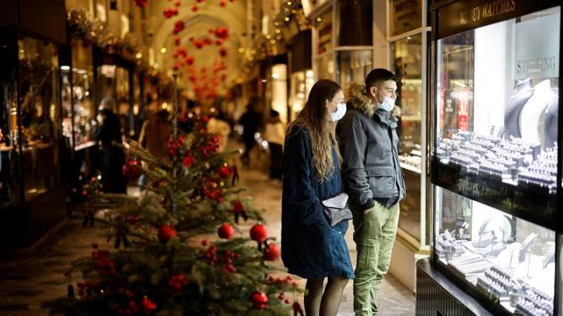 Shoppers look at shop window displays inside a christmas-themed Burlington Arcade in London on December 19. The measures will be a major blow to retail businesses at what is usually their busiest time of year, Bloomberg reported. The UK has already suffered its deepest recession since the Great Frost of 1709 and ministers have been forced to extend crisis loans and wage support programs amid fears that unemployment will rocket. (Tolga Akmen / AFP) Shoppers look at shop window displays inside a christmas-themed Burlington Arcade in London on December 19. The measures will be a major blow to retail businesses at what is usually their busiest time of year, Bloomberg reported. The UK has already suffered its deepest recession since the Great Frost of 1709 and ministers have been forced to extend crisis loans and wage support programs amid fears that unemployment will rocket. (Tolga Akmen / AFP)