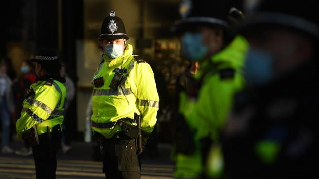 Police officers look on as protesters gather in central Newcastle-upon-Tyne on December 19, against restrictions imposed to combat the spread of the coronavirus. Britain joins Italy, Austria and Germany in tightening curbs during the holiday season, with all three countries facing rapidly rising case numbers. The situation has deteriorated dramatically across Europe, just as vaccines are being rolled out. (Oli Scarff / AFP) Police officers look on as protesters gather in central Newcastle-upon-Tyne on December 19, against restrictions imposed to combat the spread of the coronavirus. Britain joins Italy, Austria and Germany in tightening curbs during the holiday season, with all three countries facing rapidly rising case numbers. The situation has deteriorated dramatically across Europe, just as vaccines are being rolled out. (Oli Scarff / AFP)