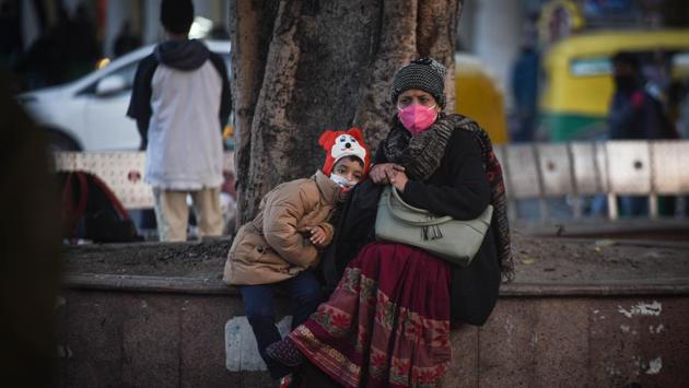 A woman and child seen in warm clothes on a winter day at Connaught Place in New Delhi on December 17. A cold wave occurs in plains when the minimum temperature is 10 degrees Celsius or below and/or is 4.5 notches lower than the season’s normal for two consecutive days. (Sanchit Khanna / HT Photo) A woman and child seen in warm clothes on a winter day at Connaught Place in New Delhi on December 17. A cold wave occurs in plains when the minimum temperature is 10 degrees Celsius or below and/or is 4.5 notches lower than the season’s normal for two consecutive days. (Sanchit Khanna / HT Photo)