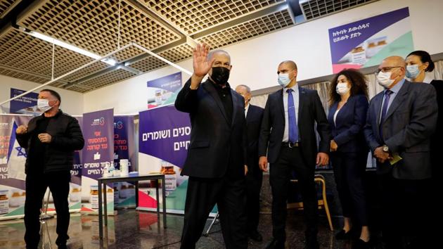 Israeli Prime Minister Benjamin Netanyahu waves as he leaves after receiving a coronavirus disease (Covid-19) vaccine at Sheba Medical Center in Ramat Gan, Israel. (Reuters) Israeli Prime Minister Benjamin Netanyahu waves as he leaves after receiving a coronavirus disease (Covid-19) vaccine at Sheba Medical Center in Ramat Gan, Israel. (Reuters)