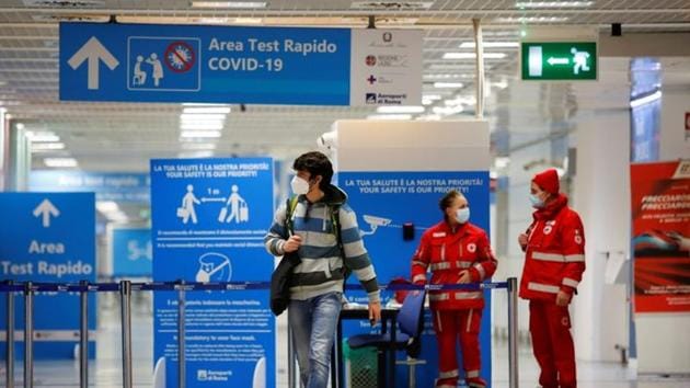 A passenger walks at Fiumicino airport after the Italian government announced all flights to and from the UK will be suspended over fears of a new strain of the coronavirus in Rome on December 20, 2020.(Reuters Photo)