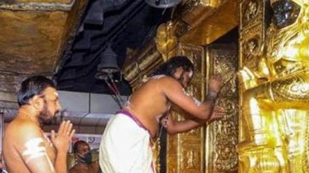 Priests perform rituals for the 'Tulamas Puja' at the Sabarimala temple, in Pathanamthitta district.(PTI)