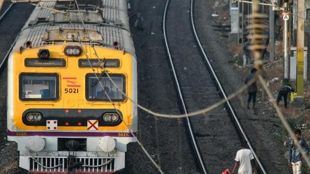 A man collects kites on railways tracks of Vile Parle station in Mumbai.(Shashi S Kashyap/ HT PHOTO)