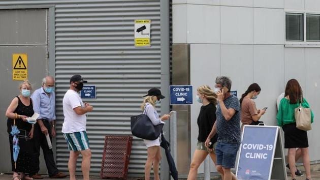People wait in line at a coronavirus disease (Covid-19) testing clinic at Mona Vale Hospital in the wake of a new outbreak in the northern beaches area of Sydney, Australia. (Reuters) People wait in line at a coronavirus disease (Covid-19) testing clinic at Mona Vale Hospital in the wake of a new outbreak in the northern beaches area of Sydney, Australia. (Reuters)