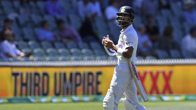 India's Virat Kohli walks off as the third umpire checks the catch that takes Kohli's wicket for 4 runs against Australia on the third day of their cricket test match at the Adelaide Oval in Adelaide, Australia, Saturday, Dec. 19, 2020. (AP Photo/David Mairuz)(AP)