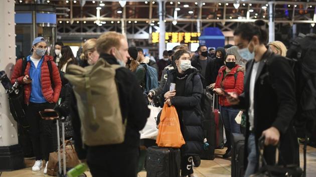 People wait on the concourse at Paddington Station in London, on the last Saturday shopping day before Christmas. (AP) People wait on the concourse at Paddington Station in London, on the last Saturday shopping day before Christmas. (AP)