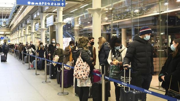 People at St Pancras station in London, wait to board the last train to Paris, on Sunday. British Prime Minister Boris Johnson said Saturday that holiday gatherings can’t go ahead and non-essential shops must close in London and much of southern England.(AP Photo) People at St Pancras station in London, wait to board the last train to Paris, on Sunday. British Prime Minister Boris Johnson said Saturday that holiday gatherings can’t go ahead and non-essential shops must close in London and much of southern England.(AP Photo)