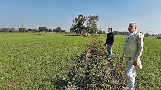 Ramesh Sharma (in white) and Satish Kumar Sherawat (in black) at Singhu village.(HT Photo)