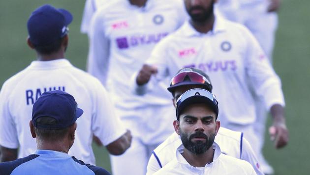 India's Virat Kohli, center right, shakes hands with coach Ravi Shastri following their loss to Australia on the third day of their cricket test match at the Adelaide Oval in Adelaide, Australia, Saturday, Dec. 19, 2020. (AP Photo/David Mariuz) (AP) India's Virat Kohli, center right, shakes hands with coach Ravi Shastri following their loss to Australia on the third day of their cricket test match at the Adelaide Oval in Adelaide, Australia, Saturday, Dec. 19, 2020. (AP Photo/David Mariuz) (AP)