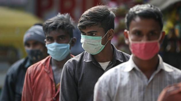 People wearing a face mask queue to give swab samples for Covid-19 test at Peeragarhi in New Delhi on December 20. Delhi has now added a daily average of 38 deaths over the past seven days since December 20, down significantly from a high of 116 on November 24. (Sanchit Khanna / HT Photo) People wearing a face mask queue to give swab samples for Covid-19 test at Peeragarhi in New Delhi on December 20. Delhi has now added a daily average of 38 deaths over the past seven days since December 20, down significantly from a high of 116 on November 24. (Sanchit Khanna / HT Photo)