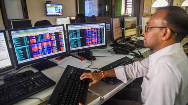 Traders monitor BSE index at a brokerage firm, as the Sensex goes down, in Mumbai. (PTI) Traders monitor BSE index at a brokerage firm, as the Sensex goes down, in Mumbai. (PTI)