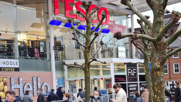 Large queues snaked around some Tesco Britons rushed to supermarkets on Monday to stock up for Christmas after stricter pandemic rules were enforced(REUTERS)