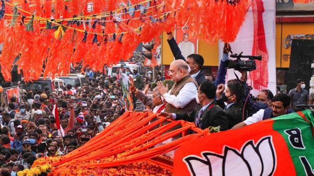 On Sunday, Shah’s convoy drove through Bolpur, the town associated with Rabindranath Tagore. Addressing people during the roadshow, Shah said his party will restore West Bengal’s old glory when it was called “sonar Bangla”. (PTI Photo) On Sunday, Shah’s convoy drove through Bolpur, the town associated with Rabindranath Tagore. Addressing people during the roadshow, Shah said his party will restore West Bengal’s old glory when it was called “sonar Bangla”. (PTI Photo)