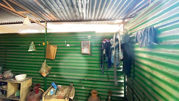 This morning, the courtyard smells of amla (gooseberry) hair oil and Lifebuoy soap. One corner is piled up with ladders and ballis (wooden poles), probably the work equipments of the dwellers. The only room on this floor has its door partially open. Three men are asleep, loudly snoring. (HT Photo) This morning, the courtyard smells of amla (gooseberry) hair oil and Lifebuoy soap. One corner is piled up with ladders and ballis (wooden poles), probably the work equipments of the dwellers. The only room on this floor has its door partially open. Three men are asleep, loudly snoring. (HT Photo)