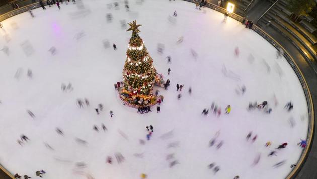 People ice skate around a Christmas tree in Kyiv, Ukraine on December 21. (Efrem Lukatsky / AP) People ice skate around a Christmas tree in Kyiv, Ukraine on December 21. (Efrem Lukatsky / AP)