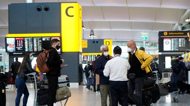 Travellers stand at check-in desks at Terminal 2 of Heathrow Airport in west London.(AFP) Travellers stand at check-in desks at Terminal 2 of Heathrow Airport in west London.(AFP)