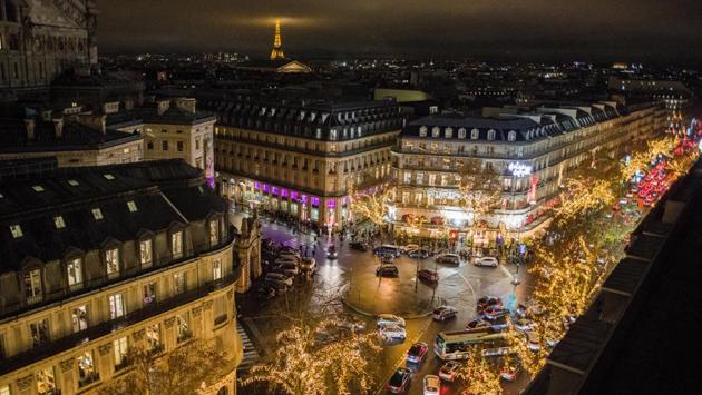 A view of the Eiffel tower seen from the rooftop of the Galeries Lafayette department store in Paris, France on December 21. A night curfew from 8pm to 6am is imposed in Frace until mid-January, apart from Christmas Eve. (Nathan Laine / Bloomberg) A view of the Eiffel tower seen from the rooftop of the Galeries Lafayette department store in Paris, France on December 21. A night curfew from 8pm to 6am is imposed in Frace until mid-January, apart from Christmas Eve. (Nathan Laine / Bloomberg)