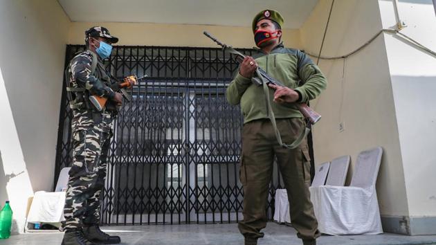 Security personnel stand guard outside a strongroom, where ballot boxes are kept at a counting centre in Jammu. (PTI) Security personnel stand guard outside a strongroom, where ballot boxes are kept at a counting centre in Jammu. (PTI)