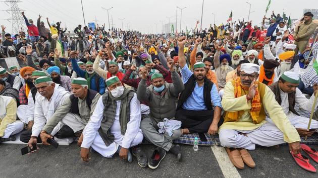 Farmers during a protest march against the Centre's agri-laws, at Delhi-Meerut Expressway in New Delhi, Friday.(PTI)