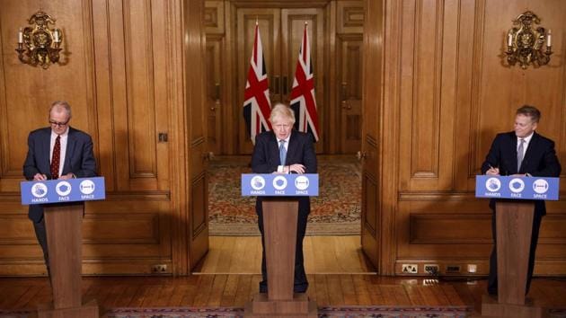 British Prime Minister Boris Johnson (C), chief scientific adviser Sir Patrick Vallance (L), and Transport Secretary Grant Shapps during a media briefing in London on December 21. “I will say that the evidence on this virus is it spreads easily, it’s more transmissible, we absolutely need to make sure we’ve got the right level of restrictions in place,” Vallance told a news conference, adding that tighter restrictions on public life were likely. (Tolga Akmen / Pool via AP) British Prime Minister Boris Johnson (C), chief scientific adviser Sir Patrick Vallance (L), and Transport Secretary Grant Shapps during a media briefing in London on December 21. “I will say that the evidence on this virus is it spreads easily, it’s more transmissible, we absolutely need to make sure we’ve got the right level of restrictions in place,” Vallance told a news conference, adding that tighter restrictions on public life were likely. (Tolga Akmen / Pool via AP)