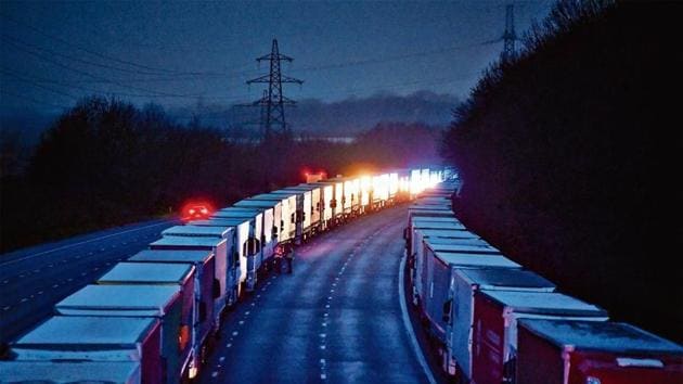 Lorries are seen parked on the M20 motorway, as EU countries impose a travel ban from the UK following the coronavirus disease (COVID-19) outbreak, near Ashford. (Reuters) Lorries are seen parked on the M20 motorway, as EU countries impose a travel ban from the UK following the coronavirus disease (COVID-19) outbreak, near Ashford. (Reuters)