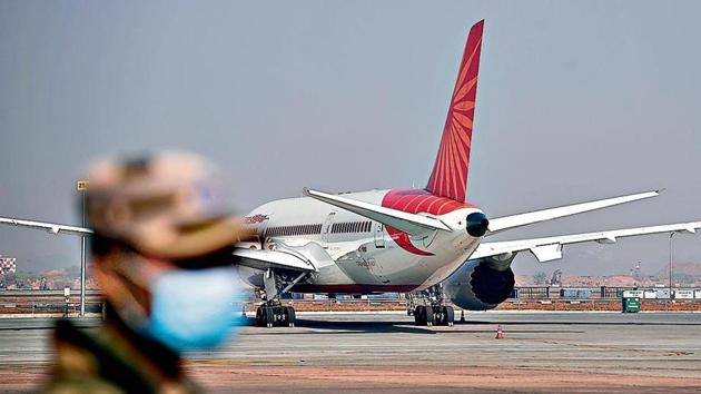 A security personnel stands guard near the Cargo Terminal 2 of the Indira Gandhi International Airport, which will be used as a Covid-19 coronavirus vaccines handling and distribution center during the media preview in New Delhi on December 22, 2020. (Photo: AFP) A security personnel stands guard near the Cargo Terminal 2 of the Indira Gandhi International Airport, which will be used as a Covid-19 coronavirus vaccines handling and distribution center during the media preview in New Delhi on December 22, 2020. (Photo: AFP)