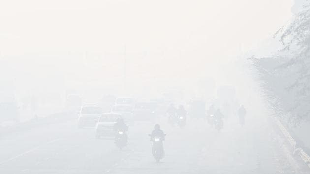 Commuters drive through a thick layer of smog at Azadpur road in New Delhi on December 23. Delhi’s air quality continued to remain in the severe category on December 23 morning, with the average hourly air quality index (AQI) reading reaching 435 at 7am, HT reported. (Sanchit Khanna / HT Photo)