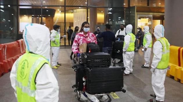 File photo: Passengers wearing protective face masks leave upon arrival at Chhatrapati Shivaji Maharaj International Airport. (REUTERS) File photo: Passengers wearing protective face masks leave upon arrival at Chhatrapati Shivaji Maharaj International Airport. (REUTERS)