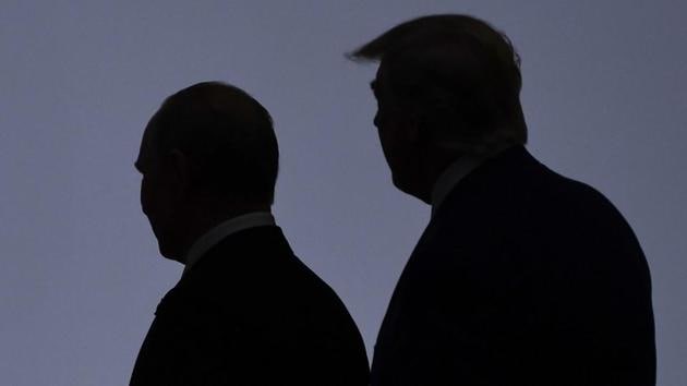 In this file photo taken on June 28, 2019, US President Donald Trump (right) walks with Russia's President Vladimir Putin before taking a family photo at the G20 Summit in Osaka. (AFP/ FILE) In this file photo taken on June 28, 2019, US President Donald Trump (right) walks with Russia's President Vladimir Putin before taking a family photo at the G20 Summit in Osaka. (AFP/ FILE)