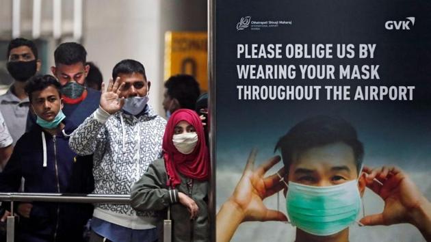People wearing protective face masks wait for passengers to arrive at Mumbai’s Chhatrapati Shivaji Maharaj International Airport after India cancelled all flights from the UK over fears of a new strain of the coronavirus disease (COVID-19). (REUTERS) People wearing protective face masks wait for passengers to arrive at Mumbai’s Chhatrapati Shivaji Maharaj International Airport after India cancelled all flights from the UK over fears of a new strain of the coronavirus disease (COVID-19). (REUTERS)
