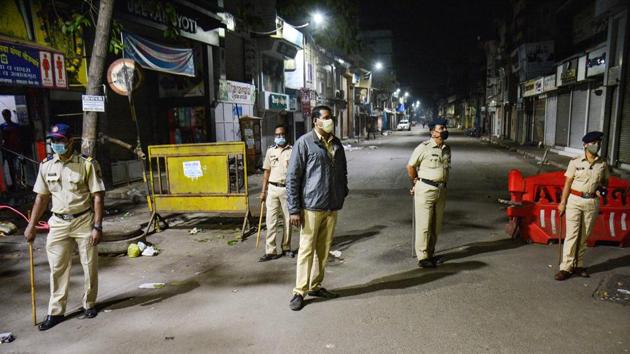 Police personnel on vigil during night curfew in Thane, early December 23. The state government’s notification empowers district collectors to impose the night curfew if they feel it necessary to contain the epidemic in their jurisdictions. However, the district collectors will have to take prior permission from chief secretary Sanjay Kumar. (PTI) Police personnel on vigil during night curfew in Thane, early December 23. The state government’s notification empowers district collectors to impose the night curfew if they feel it necessary to contain the epidemic in their jurisdictions. However, the district collectors will have to take prior permission from chief secretary Sanjay Kumar. (PTI)