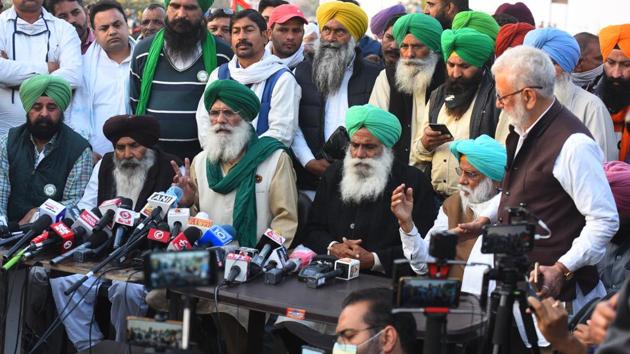 Farmer leader Surjeet Singh Phool (C, front) and others hold a press conference as farmers continue to camp at Singhu border against the new farm, near New Delhi on November 29. The protests had participations by the Samyukta Kisan Morcha, the Rashtriya Kisan Mahasanghathan, Jai Kisan Andolan, All India Kisan Mazdoor Sabha, Krantikari Kisan Union, Bharatiya Kisan Union (Dakaunda), BKU (Rajewal), BKU (Ekta-Urgahan,) and the BKU (Chaduni). (Raj K Raj / HT Photo) Farmer leader Surjeet Singh Phool (C, front) and others hold a press conference as farmers continue to camp at Singhu border against the new farm, near New Delhi on November 29. The protests had participations by the Samyukta Kisan Morcha, the Rashtriya Kisan Mahasanghathan, Jai Kisan Andolan, All India Kisan Mazdoor Sabha, Krantikari Kisan Union, Bharatiya Kisan Union (Dakaunda), BKU (Rajewal), BKU (Ekta-Urgahan,) and the BKU (Chaduni). (Raj K Raj / HT Photo)