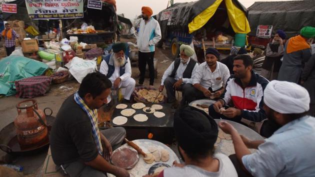 Rotis being prepared in a community kitchen at Singhu border near New Delhi on December 10. (Ajay Aggarwal / HT Photo) Rotis being prepared in a community kitchen at Singhu border near New Delhi on December 10. (Ajay Aggarwal / HT Photo)