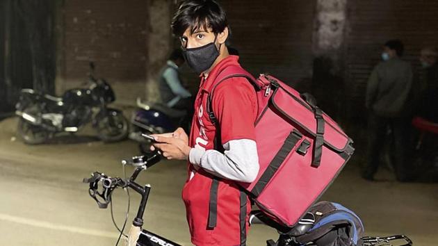 Pratikansh works as a delivery man daily from 2pm to 10pm, and spends the day’s earlier part helping his mother with her “chhota mota (small-time)” job.(HT Photo)