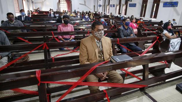 Devotees offer prayers inside a church on the occasion of Christmas festival, in Ahmedabad, India on December 25. (PTI) Devotees offer prayers inside a church on the occasion of Christmas festival, in Ahmedabad, India on December 25. (PTI)