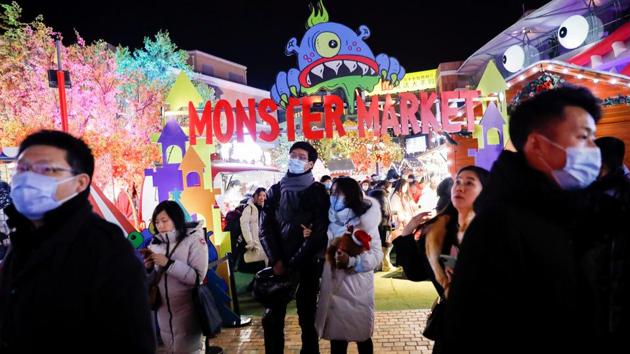 People visit an outdoor market inside a shopping complex on Christmas Day in Beijing, China on December 25. (Tingshu Wang / REUTERS) People visit an outdoor market inside a shopping complex on Christmas Day in Beijing, China on December 25. (Tingshu Wang / REUTERS)