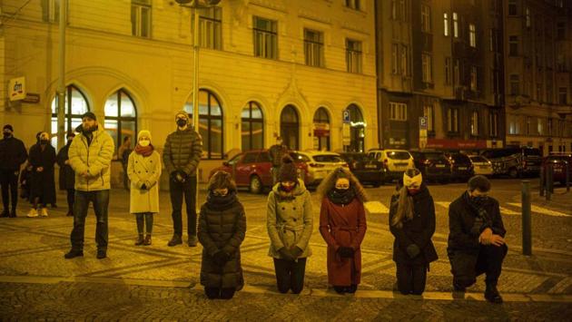 People pray during a Christmas Eve outdoor mass at the Strossmayer square in Prague, Czech Republic on December 24. (Michal Cizek / AFP) People pray during a Christmas Eve outdoor mass at the Strossmayer square in Prague, Czech Republic on December 24. (Michal Cizek / AFP)