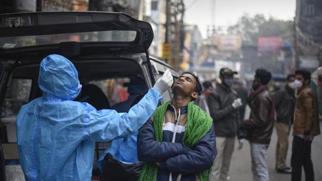 A health worker collects a swab sample for coronavirus screenig, at Bara Tuti Chowk in Sadar Bazar, New Delhi. (Biplov Bhuyan/HT PHOTO) A health worker collects a swab sample for coronavirus screenig, at Bara Tuti Chowk in Sadar Bazar, New Delhi. (Biplov Bhuyan/HT PHOTO)