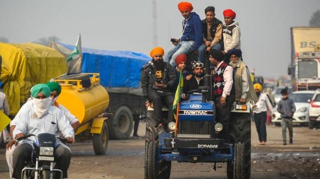 Farmers seen riding a tractor at Singhu border during the protest against the new farm laws, near New Delhi on December 4. (Amal KS / HT Photo) Farmers seen riding a tractor at Singhu border during the protest against the new farm laws, near New Delhi on December 4. (Amal KS / HT Photo)