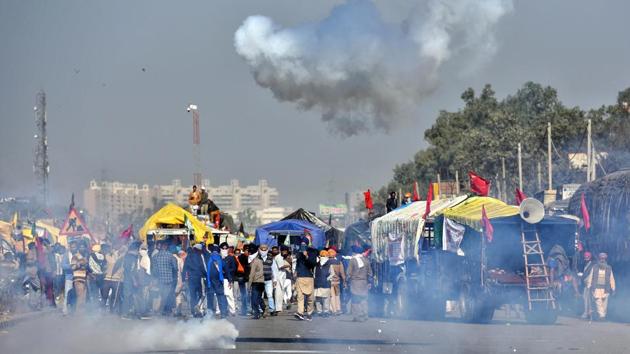 Clouds of smoke emitting from tear gas shells fired at farmers during a protest against the new farm laws, at Singhu border near New Delhi on November 27. (Sanchit Khanna / HT Photo) Clouds of smoke emitting from tear gas shells fired at farmers during a protest against the new farm laws, at Singhu border near New Delhi on November 27. (Sanchit Khanna / HT Photo)