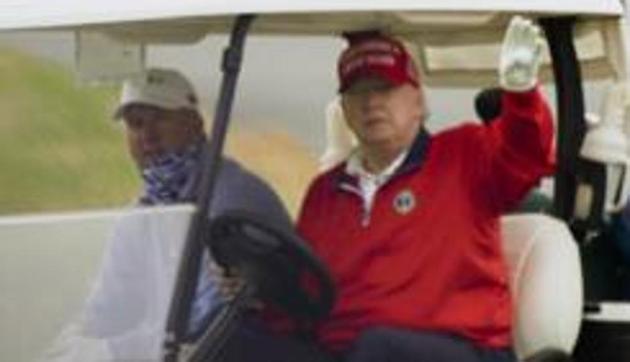 President Donald Trump spent his Christmas Eve golfing in Florida. Failure to agree on the bill could deny checks to millions of Americans on the brink.(AP file photo)