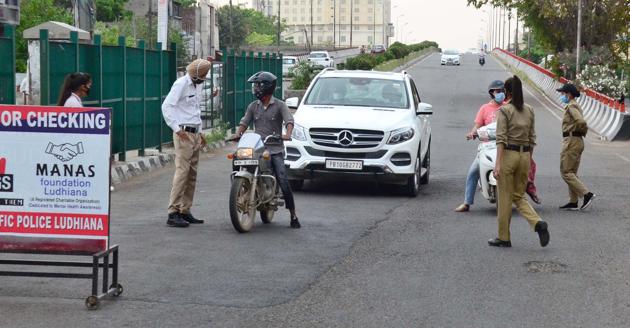 Cops enforcing the curfew in Ludhiana in April this year. The police collected over Rs 5 crore as fine, through 1.1 lakh challans issued since March. (HT File) Cops enforcing the curfew in Ludhiana in April this year. The police collected over Rs 5 crore as fine, through 1.1 lakh challans issued since March. (HT File)