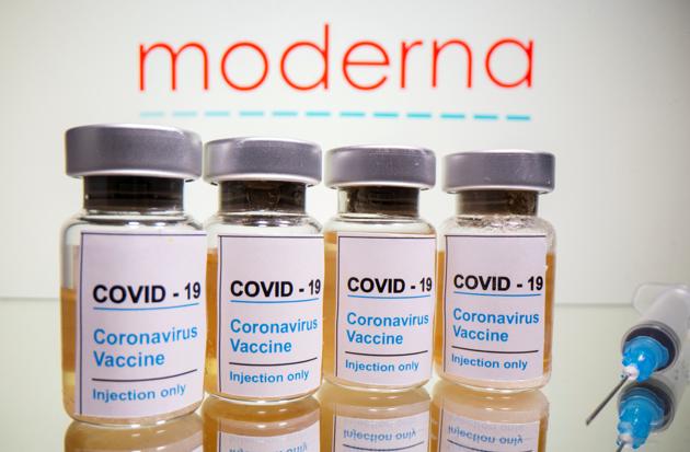 Vials with a sticker reading, "Covid-19 / Coronavirus vaccine / Injection only" and a medical syringe are seen in front of a displayed Moderna logo.(Reuters) Vials with a sticker reading, "Covid-19 / Coronavirus vaccine / Injection only" and a medical syringe are seen in front of a displayed Moderna logo.(Reuters)