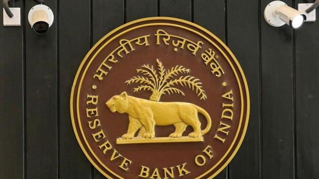 CCTV cameras are seen installed above the logo of Reserve Bank of India (RBI) inside its headquarters in Mumbai.(REUTERS)